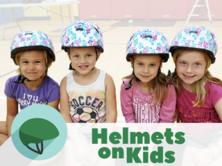 4 girls wear their new bike helmets